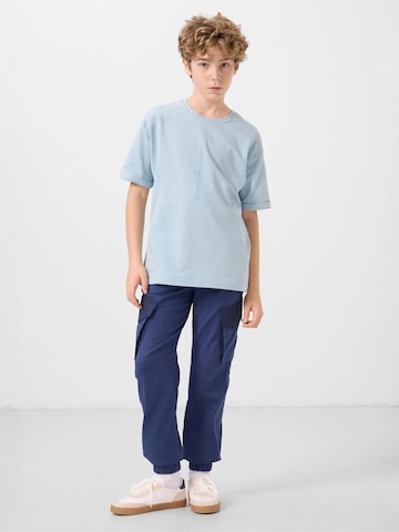 Pantalon 'TOMMY Kinder Cargo-Joggerhose' Tommy Life en bleu : devant