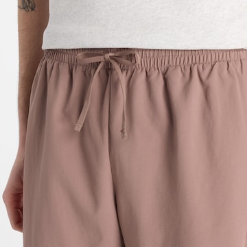 Regular Pantalon de sport 'Essentials 7' new balance en beige