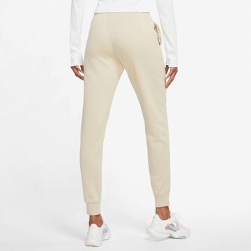 Nike Sportswear Tapered Trousers in Beige