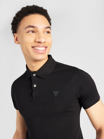 GUESS Poloshirt 'NOLAN' in Schwarz