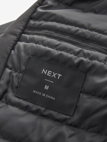 Next Mantel in Schwarz