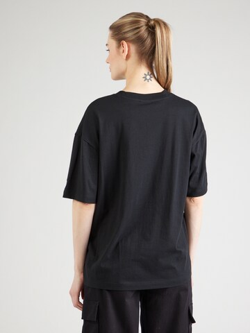 Maglietta di Champion Authentic Athletic Apparel in nero