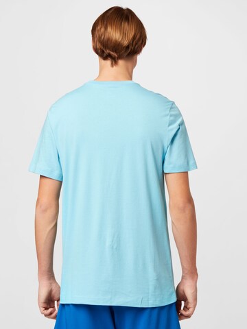 Nike Sportswear - Camisa 'Swoosh' em azul