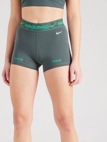 NIKE Skinny Sports trousers in Green: front