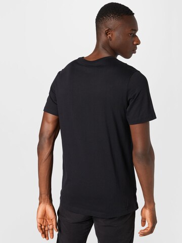 Nike Sportswear - Camiseta 'HEATWAVE' en negro