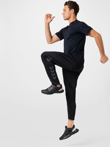 Effilé Pantalon de sport 'Legacy' Hummel en noir