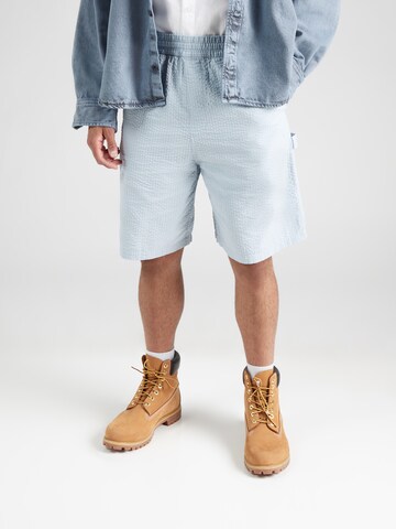 Carhartt WIP Loosefit Kalhoty 'Toland' – modrá: přední strana