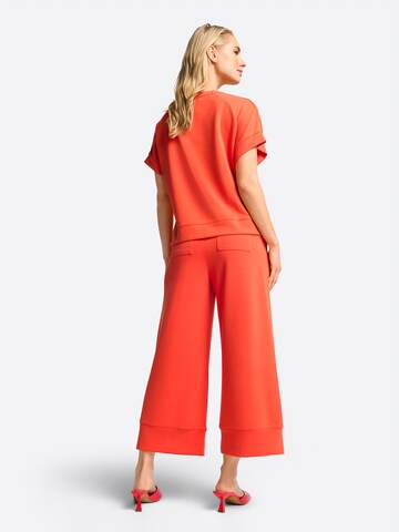 Rich & Royal - Pierna ancha Pantalón en naranja