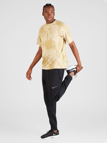 NIKE Funktionsshirt 'ADV' in Gelb