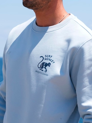 Surf Monkey - Sudadera 'Rette das Ozean' en azul
