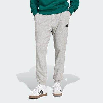 Tapered Pantaloni sportivi 'Essentials Feel Cozy' di ADIDAS SPORTSWEAR in grigio: frontale