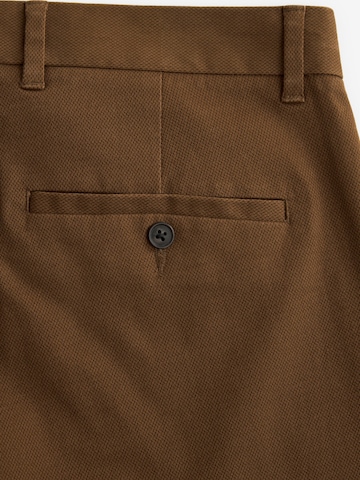 Slimfit Pantaloni chino di Next in marrone