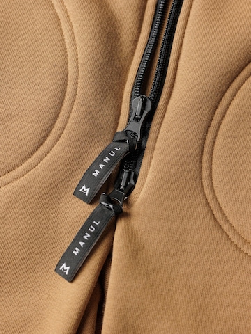 Tuta 'Latte' di MANUL in beige