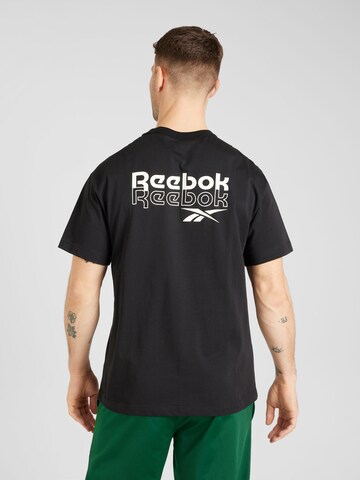 Reebok Λειτουργικό μπλουζάκι 'PROUD' σε μαύρο: μπροστά