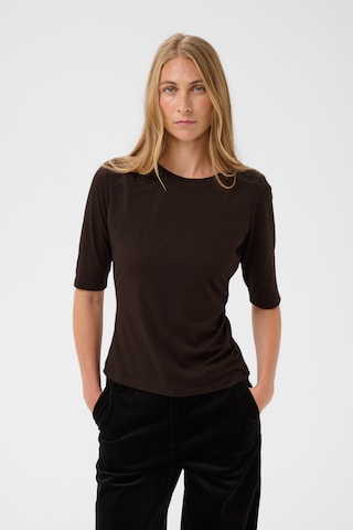 Part Two - Blusa en marrón: frente
