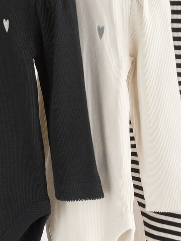 Tutina / body per bambino di Next in bianco