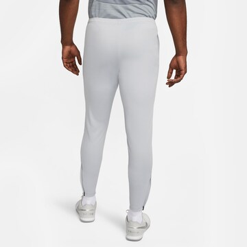 NIKE Slim fit Workout Pants 'Academy' in Grey