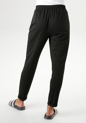 Aniston SELECTED Tapered Pleat-Front Pants in Black