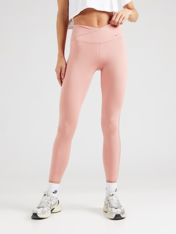NIKE Skinny Spodnie sportowe 'ONE' w kolorze różowy: przód