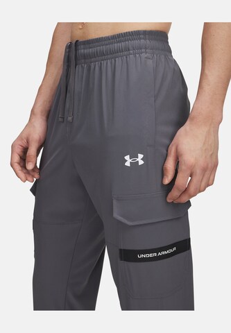 UNDER ARMOUR Tapered Sports trousers in Grey