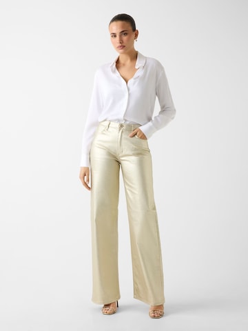 GUESS Wide leg Jeans in Gold