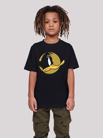 F4NT4STIC Shirt 'Looney Tunes Daffy Duck Dotted Cartoon' in Zwart: voorkant
