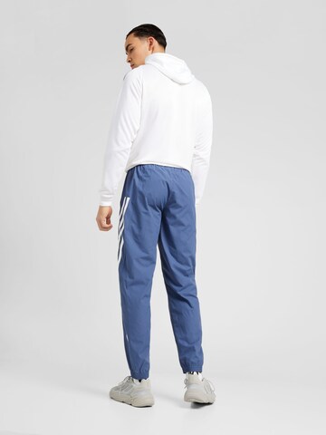 ADIDAS SPORTSWEAR Tapered Workout Pants in Blue