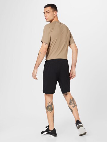 Hummel Regular Sports trousers in Black