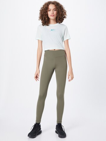 NIKE Skinny Športne hlače 'One Luxe' | zelena barva