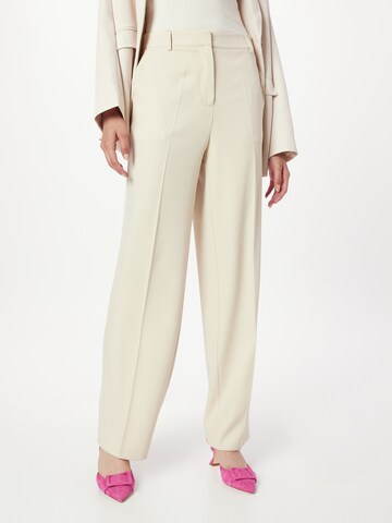 Bootcut Pantalon à plis NA-KD en beige : devant
