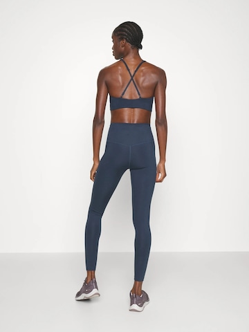 Girlfriend Collective Skinny Sportovní kalhoty ' Compressive ' – modrá