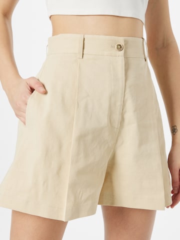 regular Pantaloni con pieghe 'SORRIDENTE' di PINKO in beige