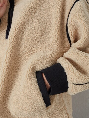 Pull-over 'Madin' co'couture en beige