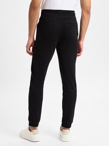Nils Sundström Slim fit Trousers in Black