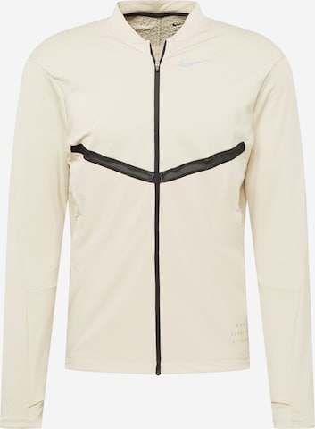 Giacca di felpa sportiva di NIKE in beige: frontale