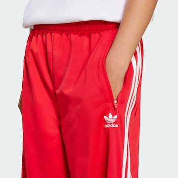 ADIDAS ORIGINALS Loose fit Trousers 'Adicolor Firebird' in Red