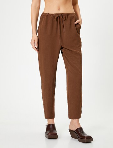 Koton Tapered Pants in Brown: front
