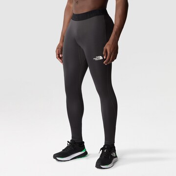 Skinny Pantalon de sport THE NORTH FACE en gris : devant