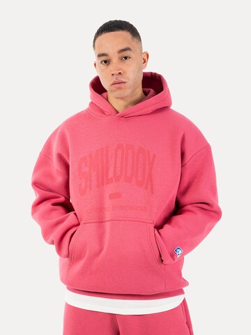 Veste de survêtement Smilodox en rose : devant
