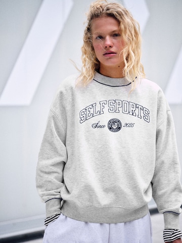 Felpa di self. in grigio: frontale
