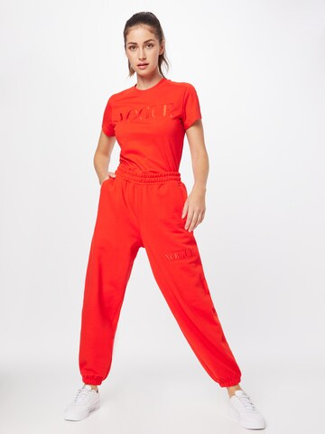 PUMA Tapered Broek in Oranje