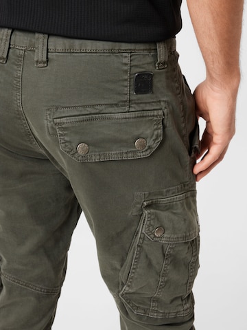 ALPHA INDUSTRIES Ozke Kargo hlače 'Combat' | siva barva