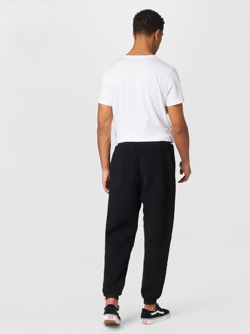 ALPHA INDUSTRIES Tapered Trousers in Black