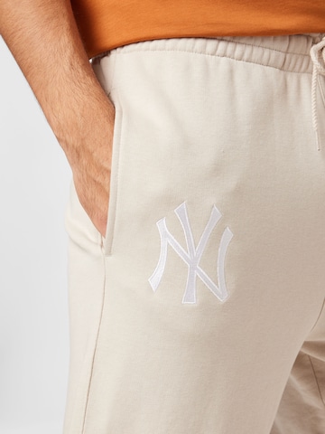 NEW ERA Tapered Pants 'League Essentials' in Beige
