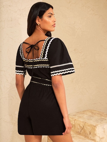 Tuta jumpsuit di love & roses in nero