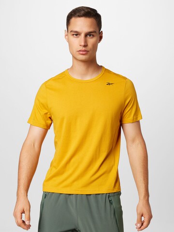 Reebok Performance Shirt in Yellow: front