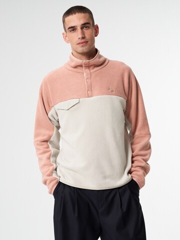 Pull-over de sport pinqponq en rose : devant