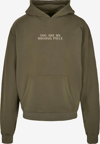 Merchcode Sweatshirt 'Missing Piece' in Groen: voorkant