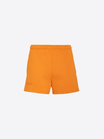 ABOUT YOU x VIAM Studio Pants 'BILLIE' in Orange: front