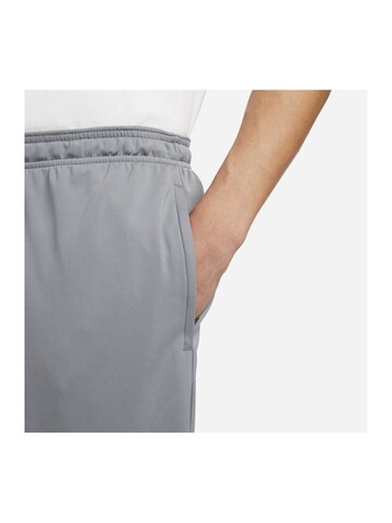NIKE Regular Sports trousers in Grey